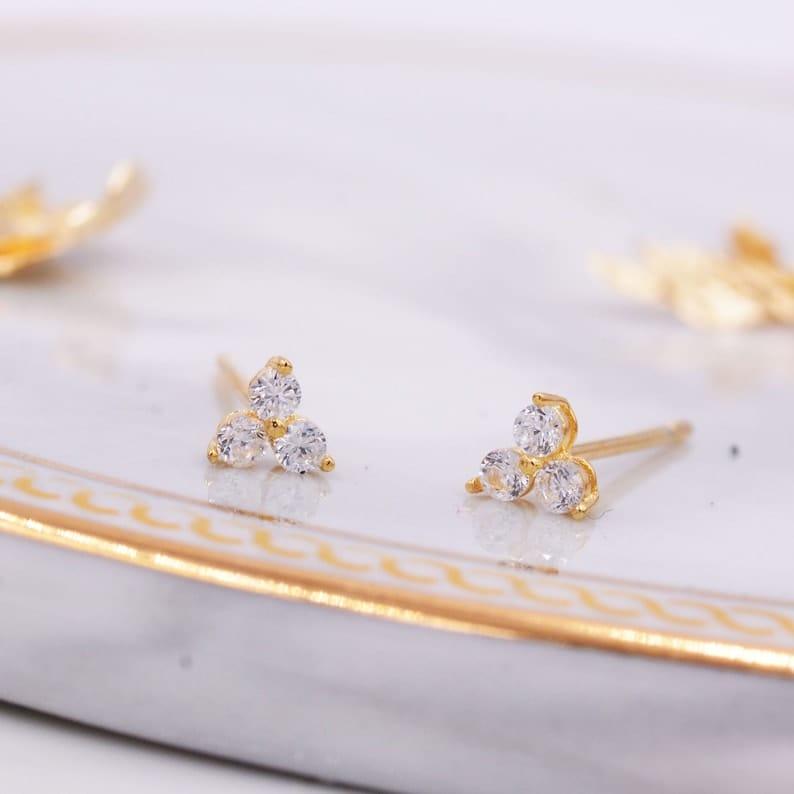 14k gold round dainty lab grown diamond earrings, top angle view showing fine craftsmanship