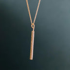 14k gold bar lab grown diamond pendant necklace, top angle view showing fine craftsmanship