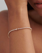14k gold lab grown diamond tennis bracelet, styled on model showing fine craftsmanship with brilliant sparkle