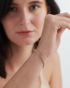 14k gold lab grown diamond tennis bracelet, styled on model showing fine craftsmanship and a polished finish