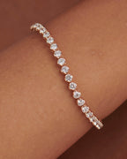 14k gold lab grown diamond tennis bracelet, detailed close-up showing fine craftsmanship with a secure setting