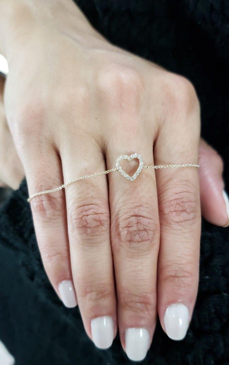 14k gold heart dainty lab grown diamond bracelet, styled on model showing fine craftsmanship