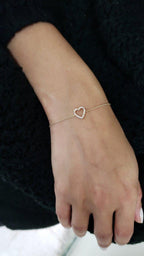 14k gold heart dainty lab grown diamond bracelet, top angle view showing fine craftsmanship