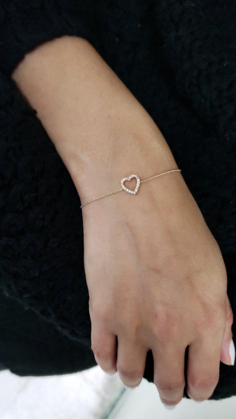 14k gold heart dainty lab grown diamond bracelet, top angle view showing fine craftsmanship
