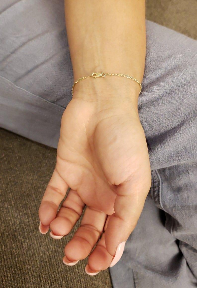 14k gold heart dainty lab grown diamond bracelet, sparkle detail shot showing fine craftsmanship