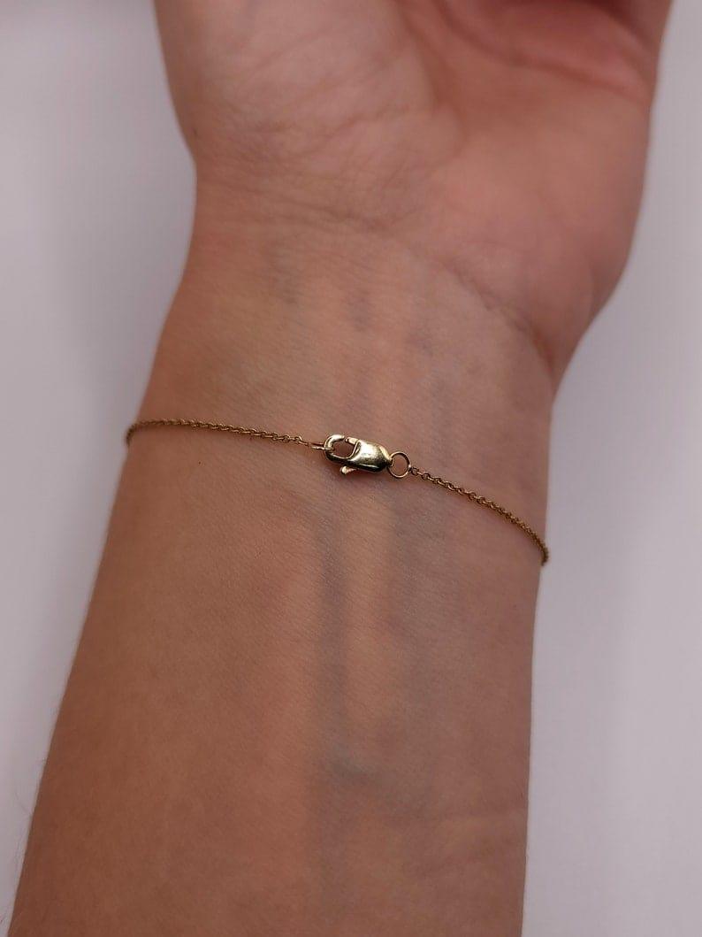 14k gold heart dainty lab grown diamond bracelet, three-quarter view showing fine craftsmanship