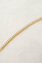 14k gold lab grown diamond tennis bracelet, styled on model showing fine craftsmanship by Bright Diamond Jewels