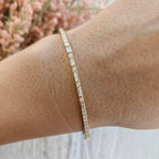 14k gold tennis lab grown diamond bangle bracelet, detailed close-up showing fine craftsmanship with brilliant sparkle