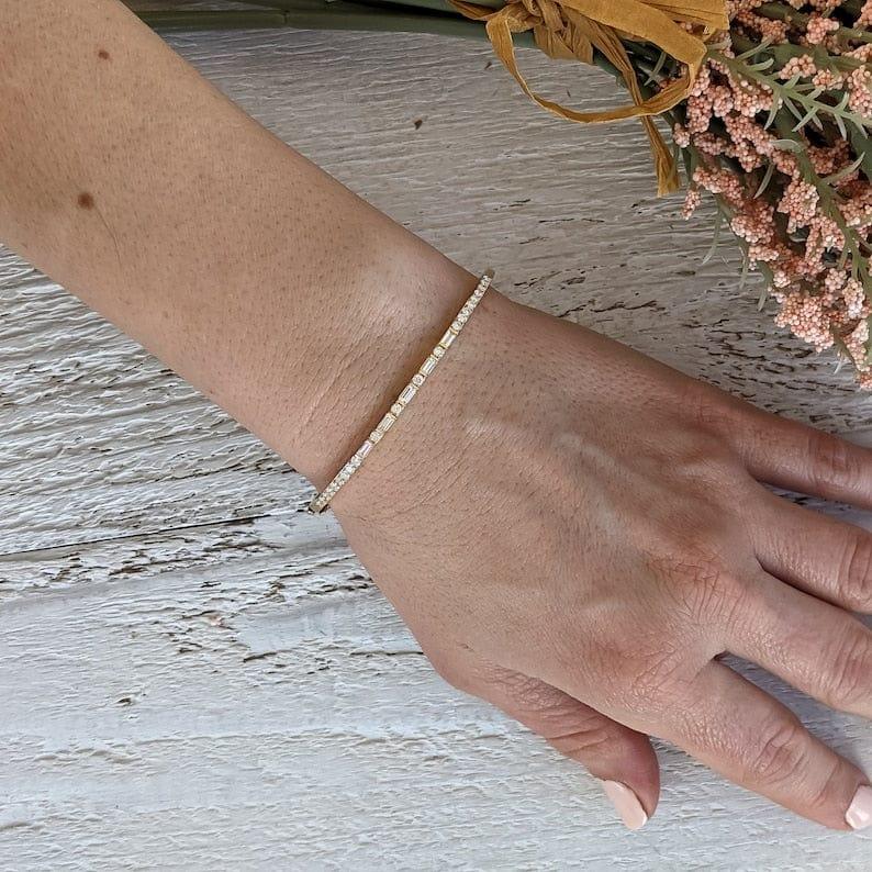 14k gold tennis lab grown diamond bangle bracelet, styled on model showing fine craftsmanship with brilliant sparkle