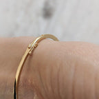 14k gold tennis lab grown diamond bangle bracelet, sparkle detail shot showing fine craftsmanship with brilliant sparkle