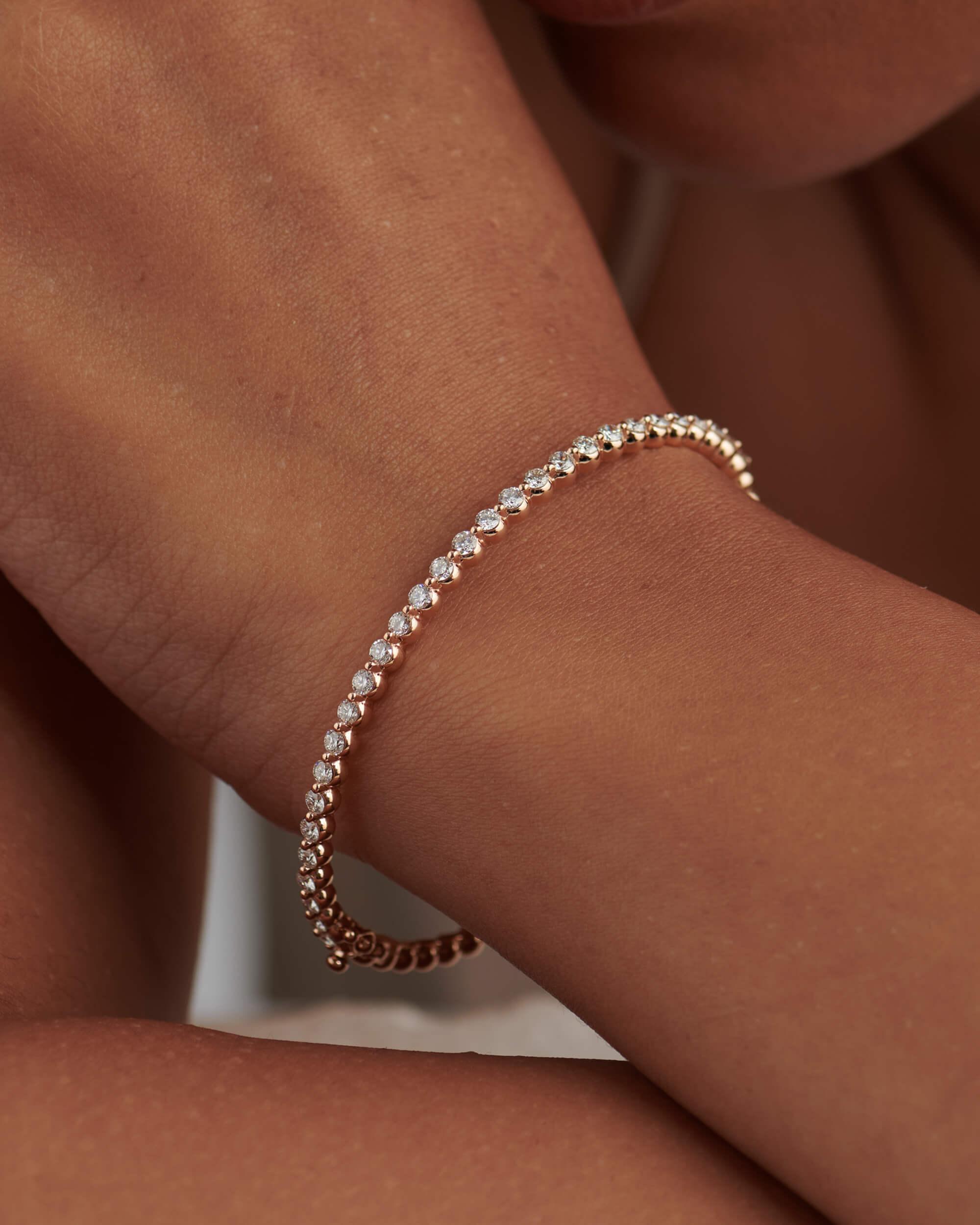 14k gold tennis lab grown diamond bangle bracelet, front view showing fine craftsmanship