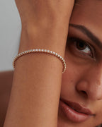 14k gold tennis lab grown diamond bangle bracelet, styled on model showing fine craftsmanship