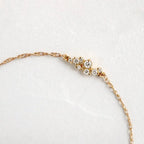14k gold dainty lab grown diamond bracelet, side profile view showing fine craftsmanship with brilliant sparkle