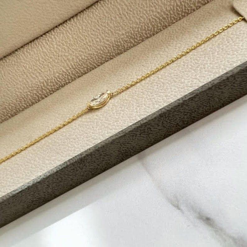 14k gold marquise dainty lab grown diamond bracelet, styled on model showing fine craftsmanship