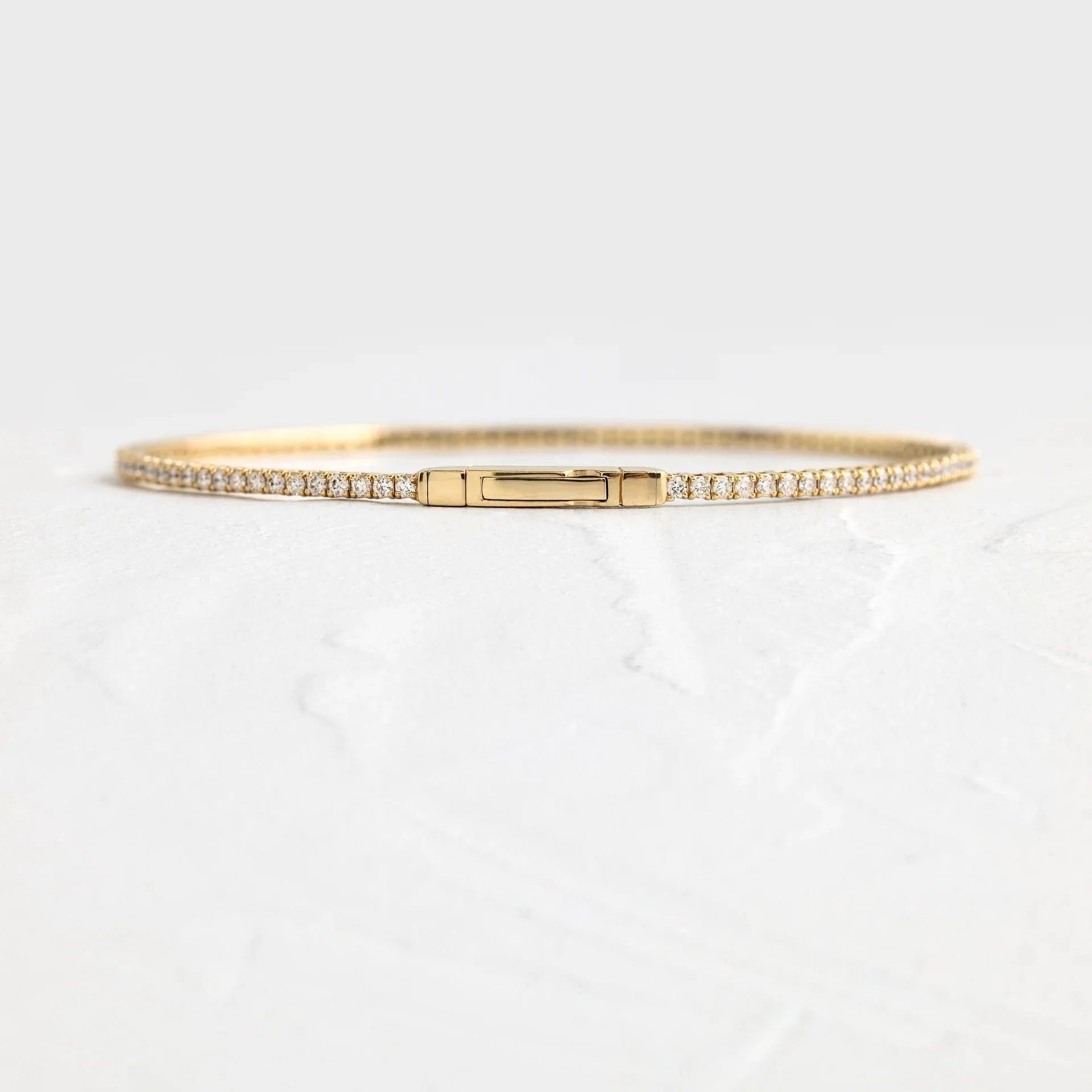 14k gold round lab grown diamond tennis bracelet, detailed close-up showing fine craftsmanship
