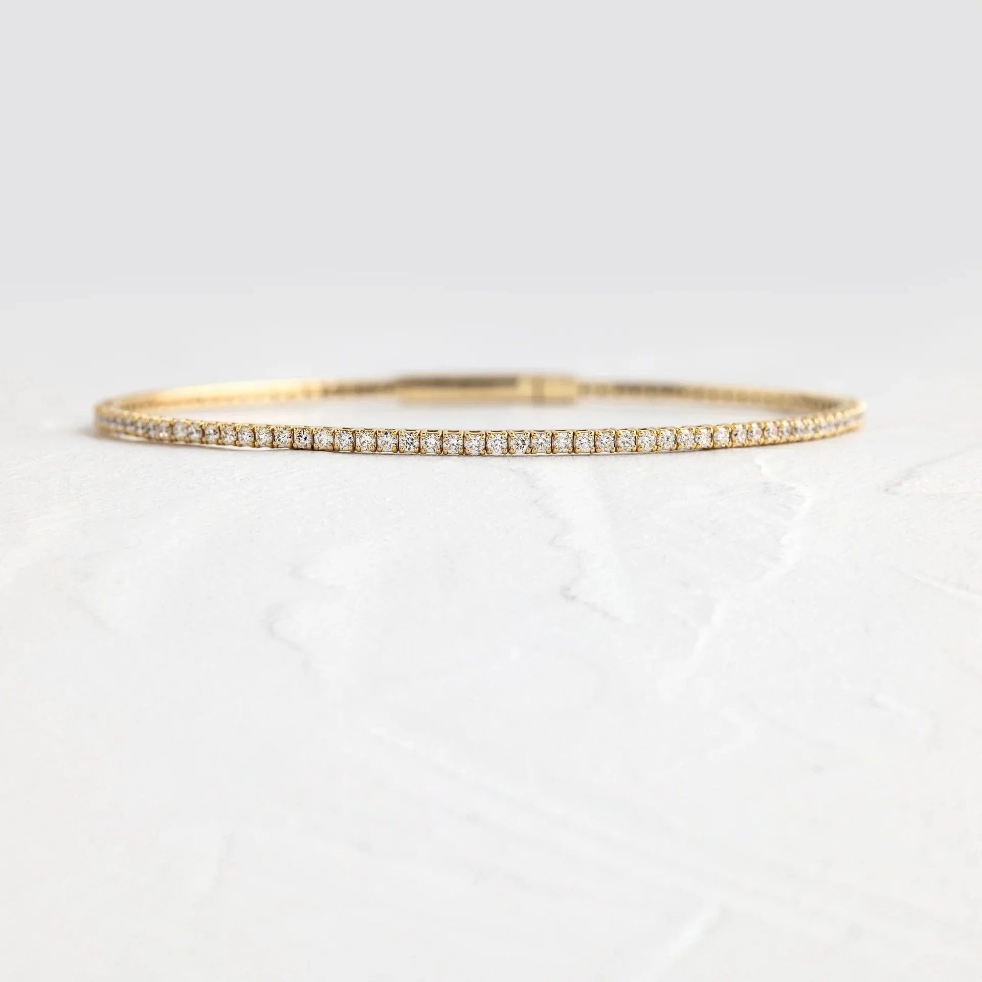 14k gold round lab grown diamond tennis bracelet, side profile view showing fine craftsmanship