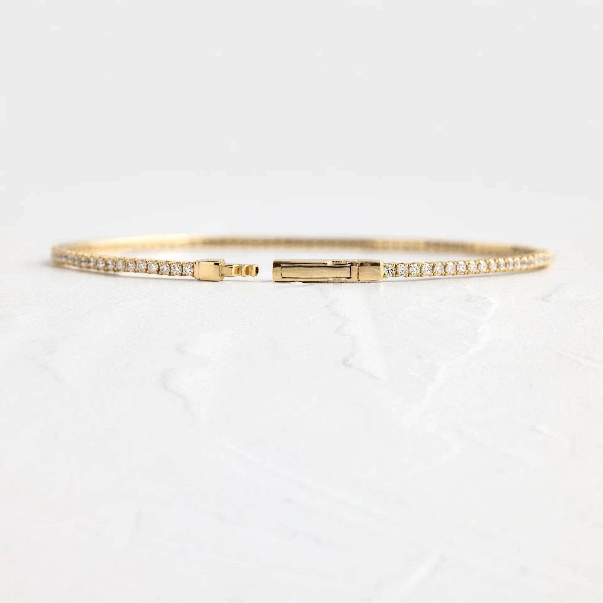 14k gold round lab grown diamond tennis bracelet, styled on model showing fine craftsmanship