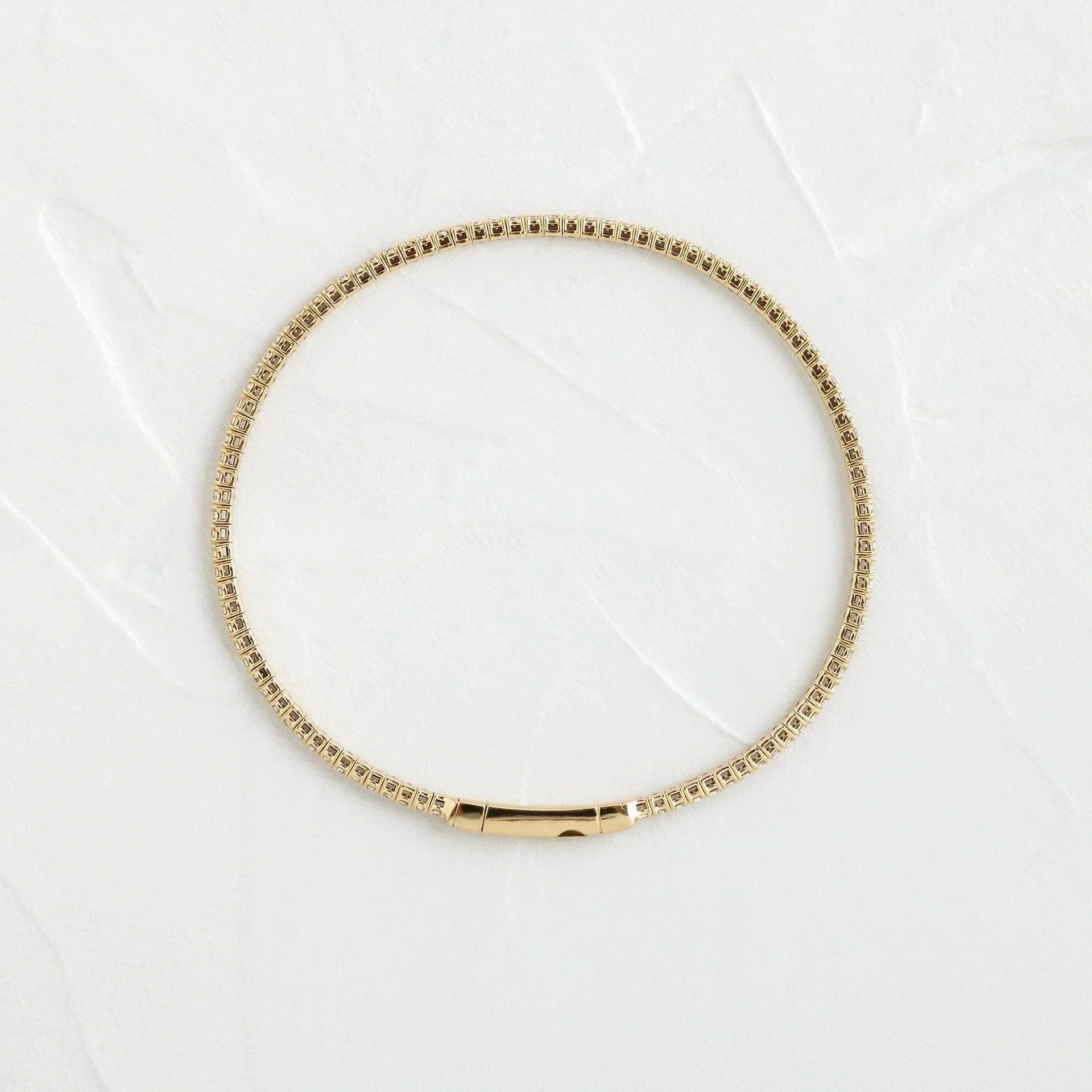 14k gold round lab grown diamond tennis bracelet, top angle view showing fine craftsmanship