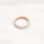 14k gold round lab grown diamond eternity band, detailed close-up showing fine craftsmanship and a polished finish