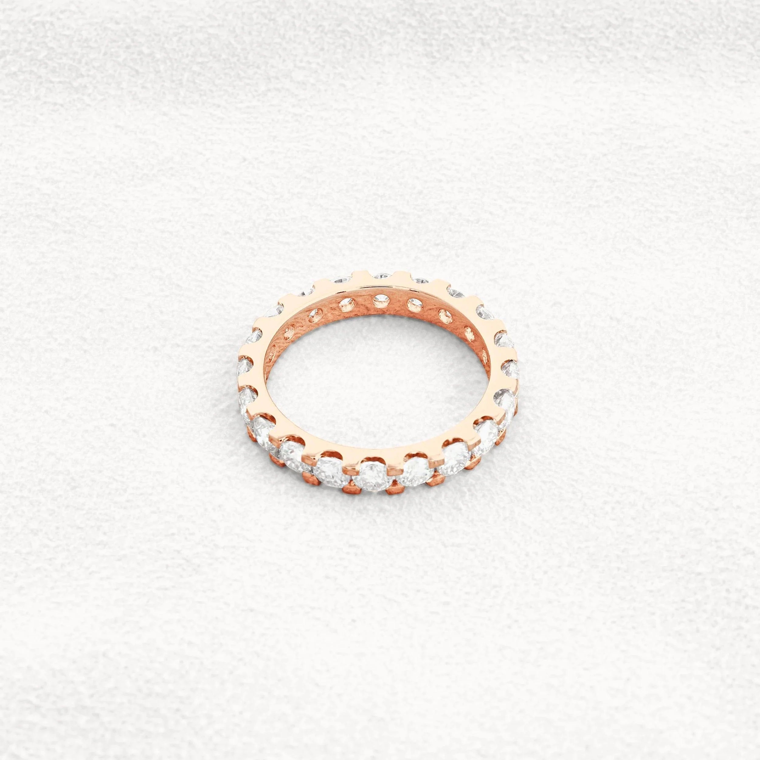 14k gold round lab grown diamond eternity band, detailed close-up showing fine craftsmanship and a polished finish