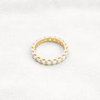 14k gold round lab grown diamond eternity band, side profile view showing fine craftsmanship and a polished finish