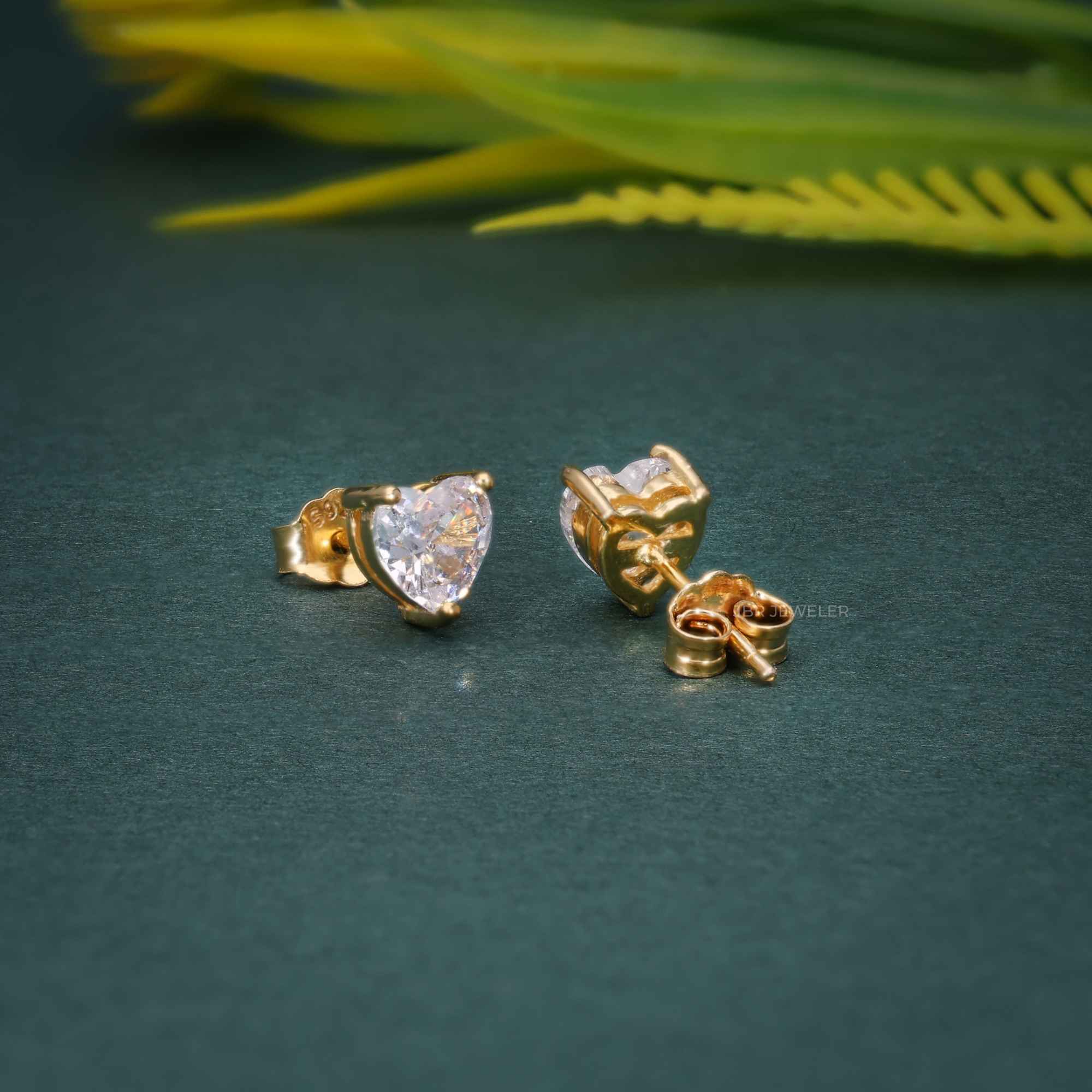 14k yellow gold heart screw back lab grown diamond stud earrings, three-quarter view showing fine craftsmanship