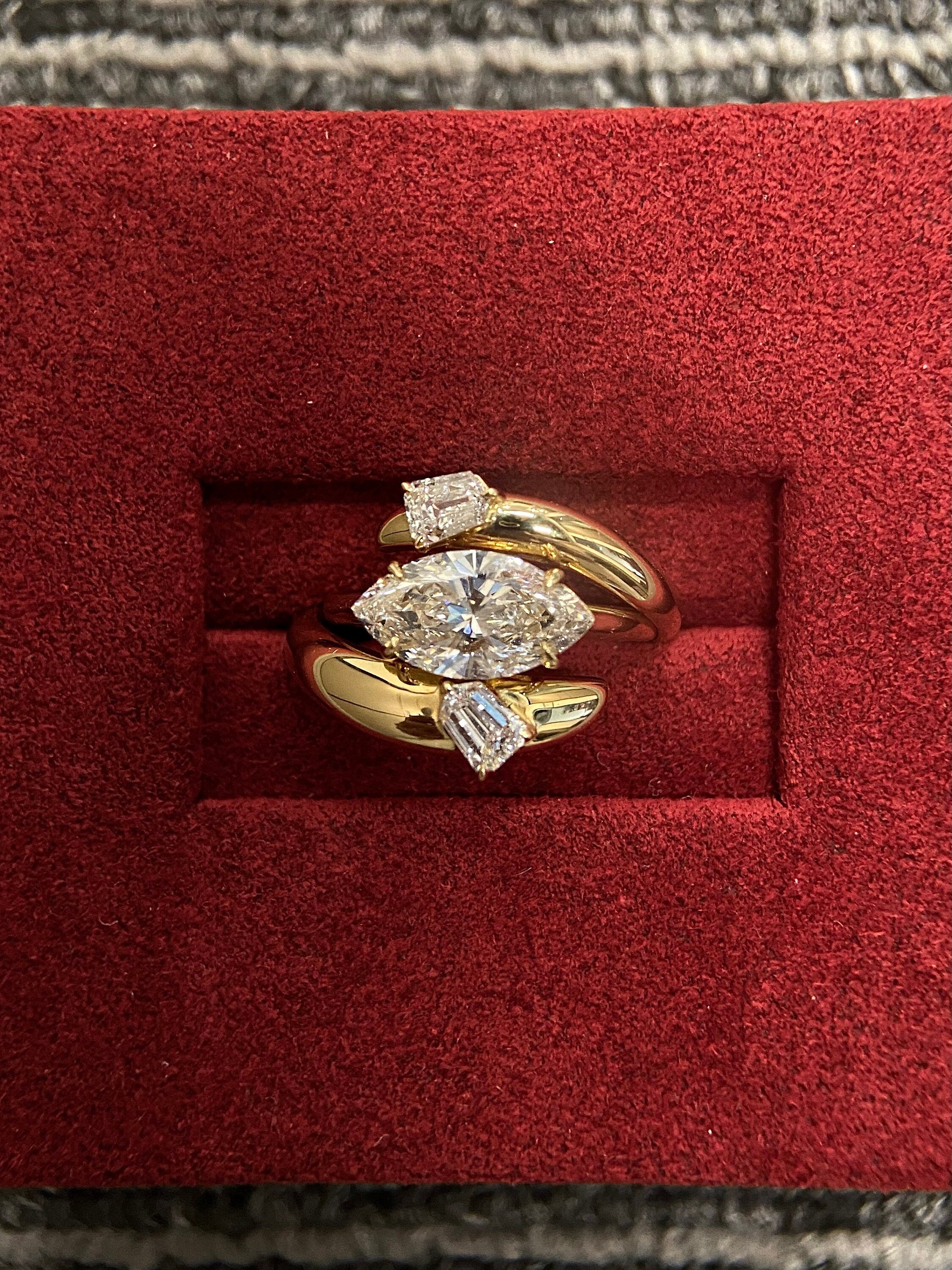 14k gold marquise three-stone lab grown diamond engagement ring, detailed close-up showing fine craftsmanship