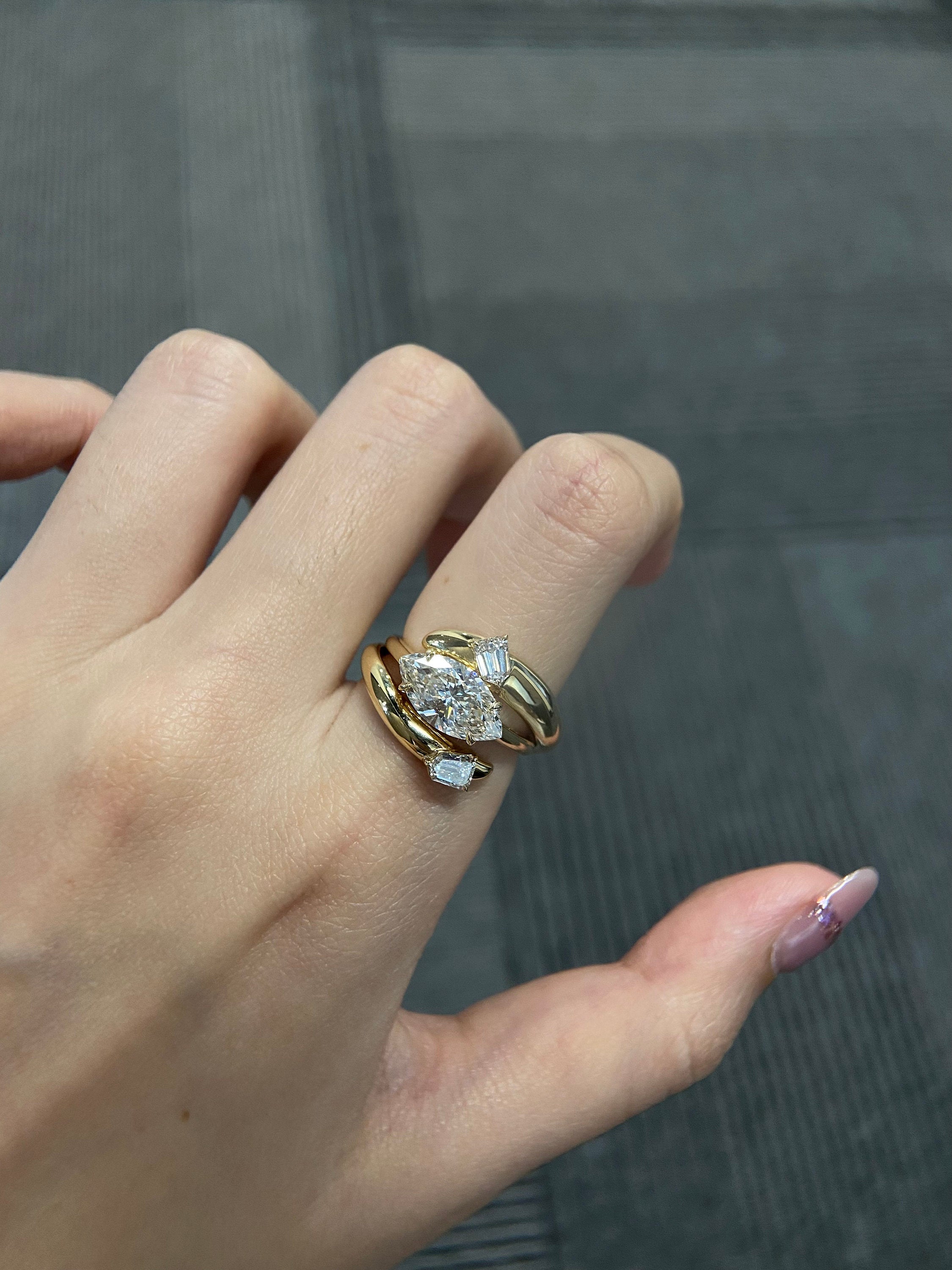 14k gold marquise three-stone lab grown diamond engagement ring, styled on model showing fine craftsmanship