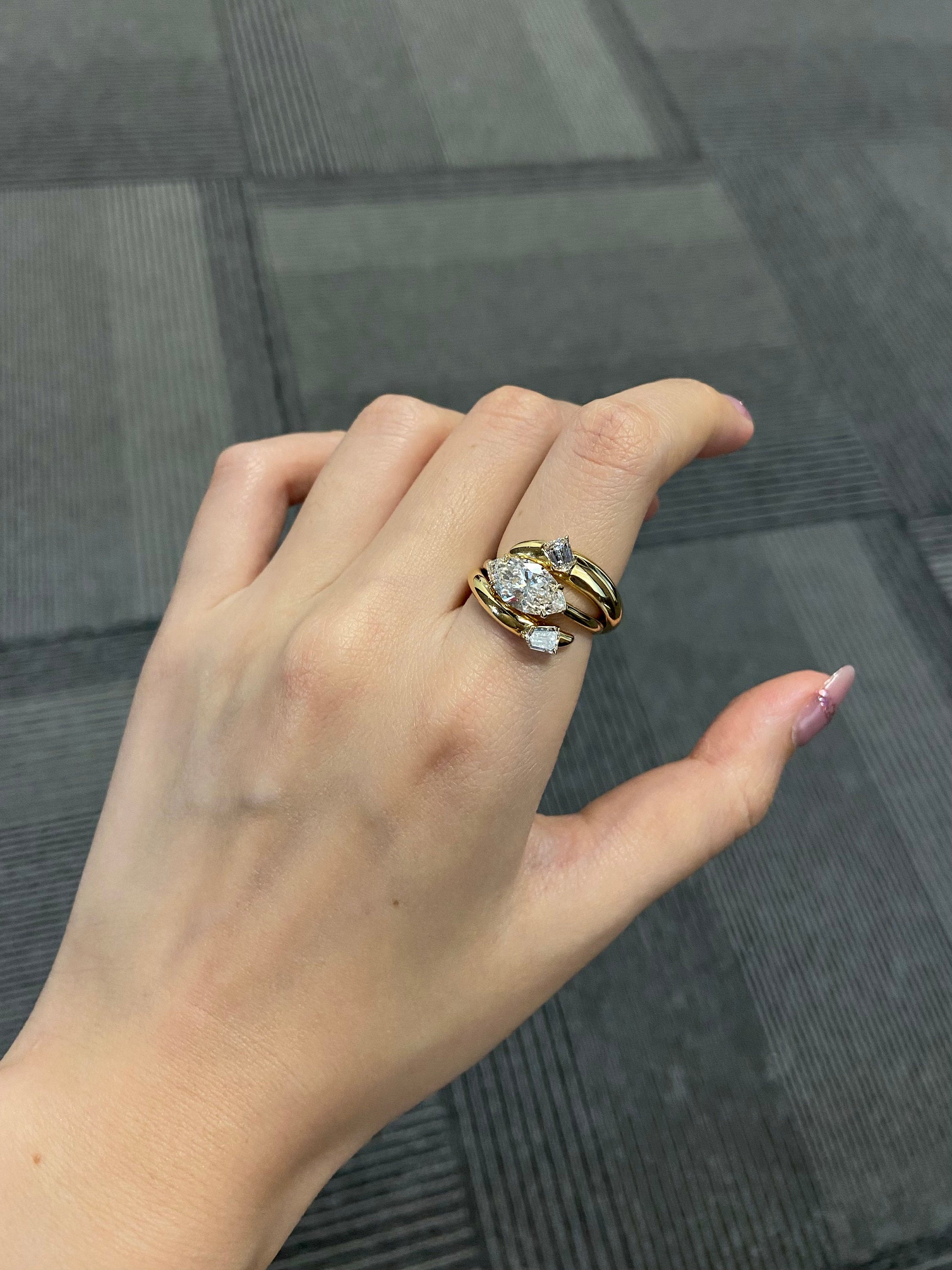 14k gold marquise three-stone lab grown diamond engagement ring, top angle view showing fine craftsmanship