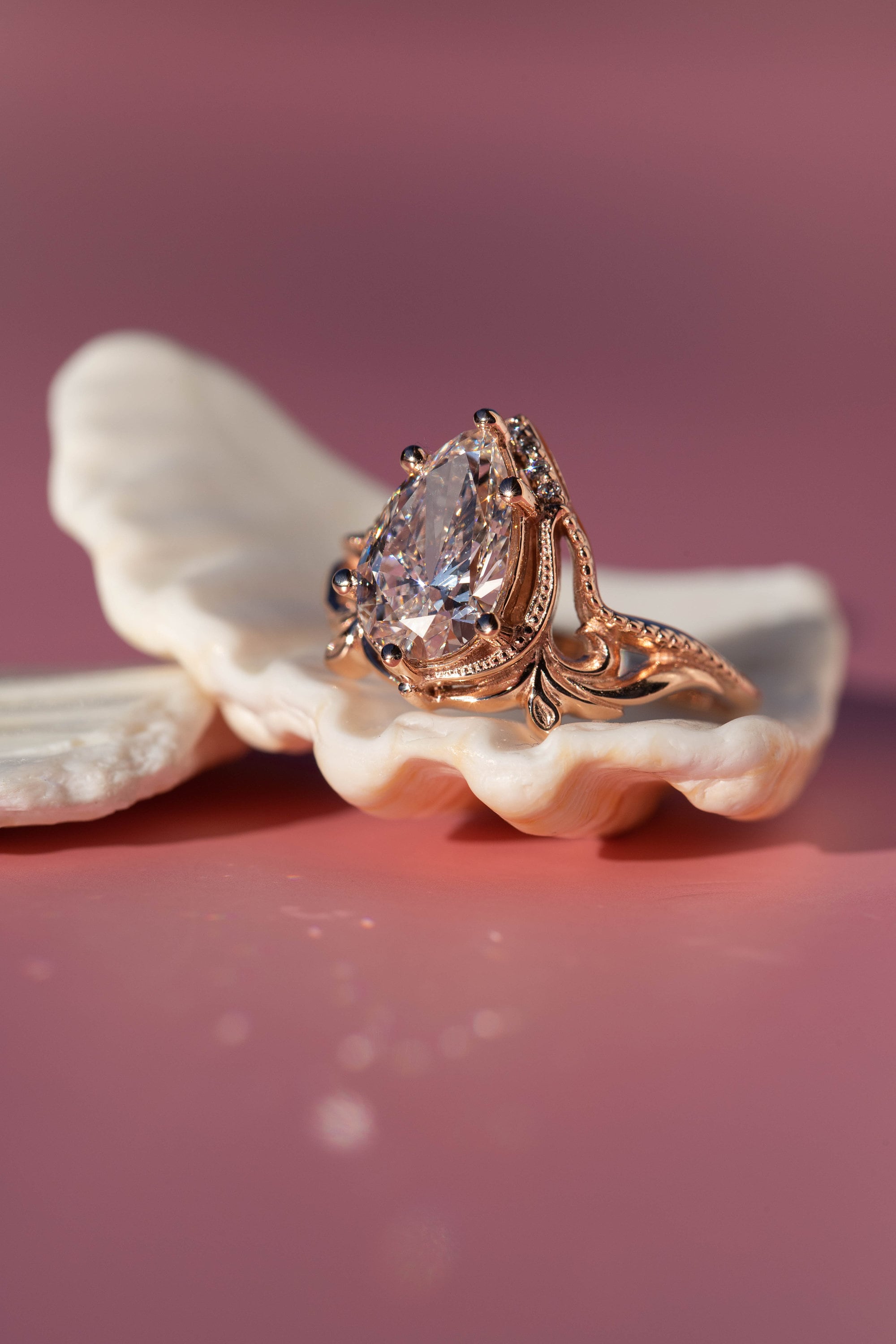 14k gold pear art nouveau lab grown diamond engagement ring, lifestyle shot showing fine craftsmanship