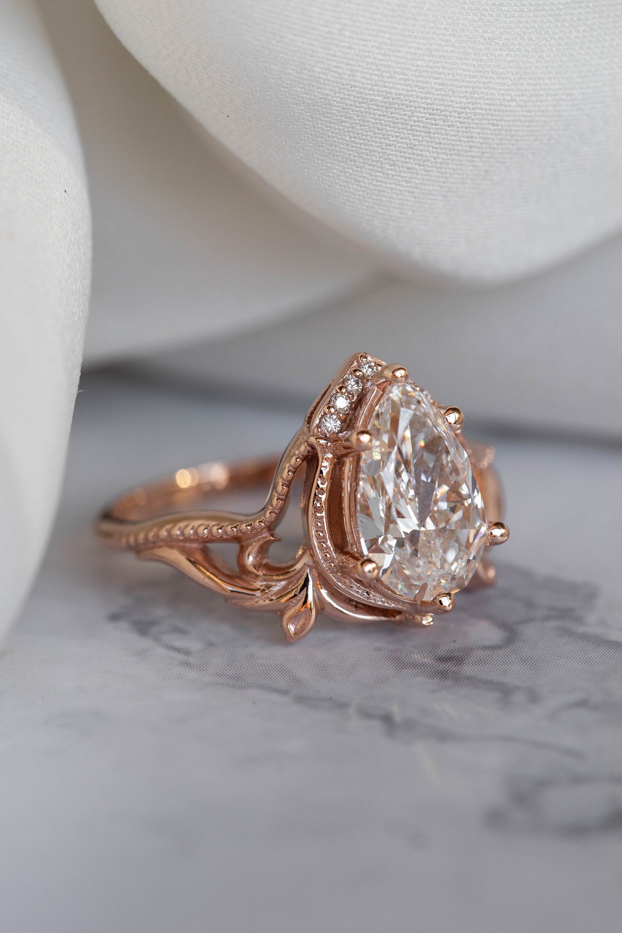 14k gold pear art nouveau lab grown diamond engagement ring, detailed close-up showing fine craftsmanship