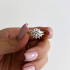 14k gold round three-stone lab grown diamond engagement ring, detailed close-up showing fine craftsmanship