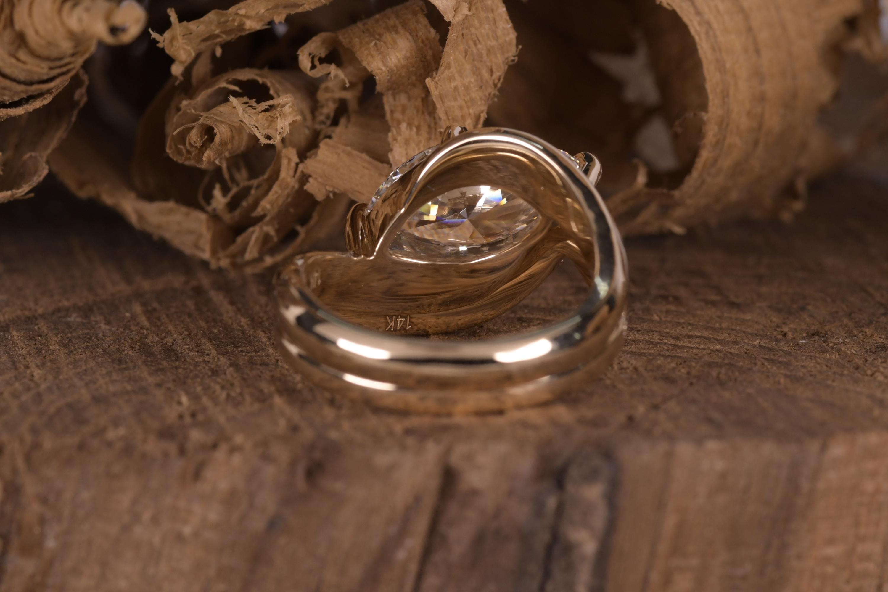 14k gold marquise bridal set lab grown diamond engagement ring, top angle view showing fine craftsmanship