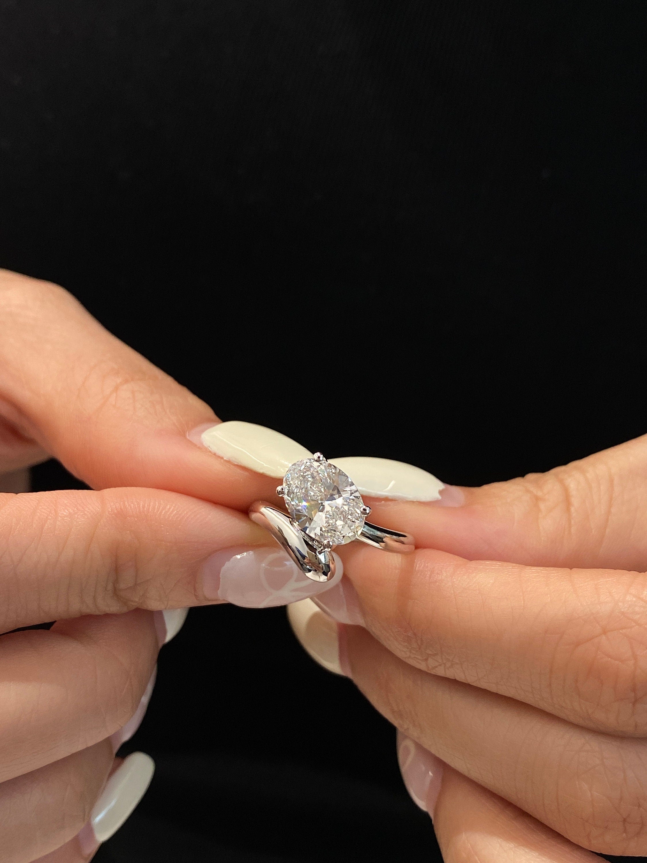 14k gold oval hidden halo lab grown diamond engagement ring, front view showing fine craftsmanship