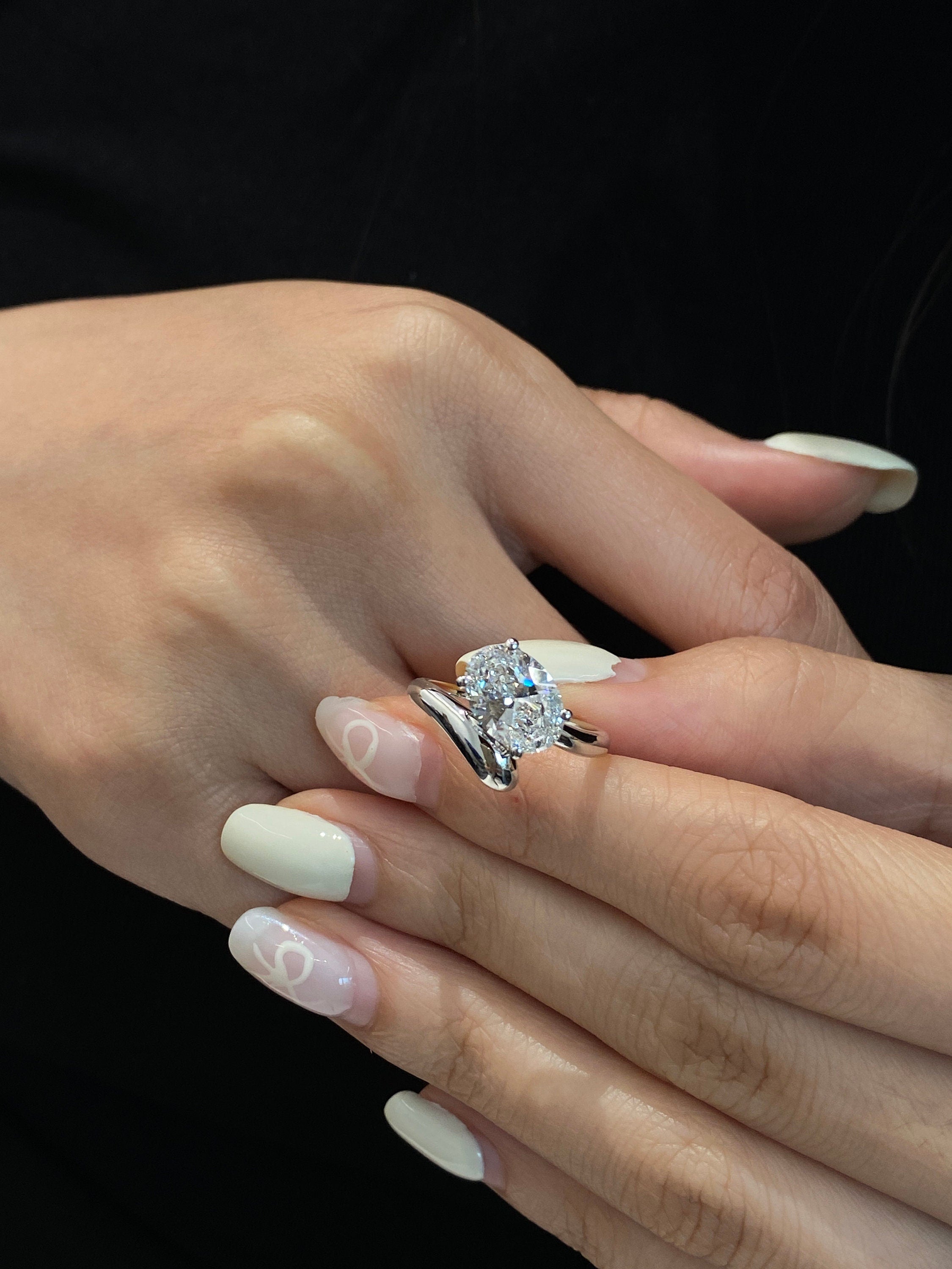 14k gold oval hidden halo lab grown diamond engagement ring, detailed close-up showing fine craftsmanship