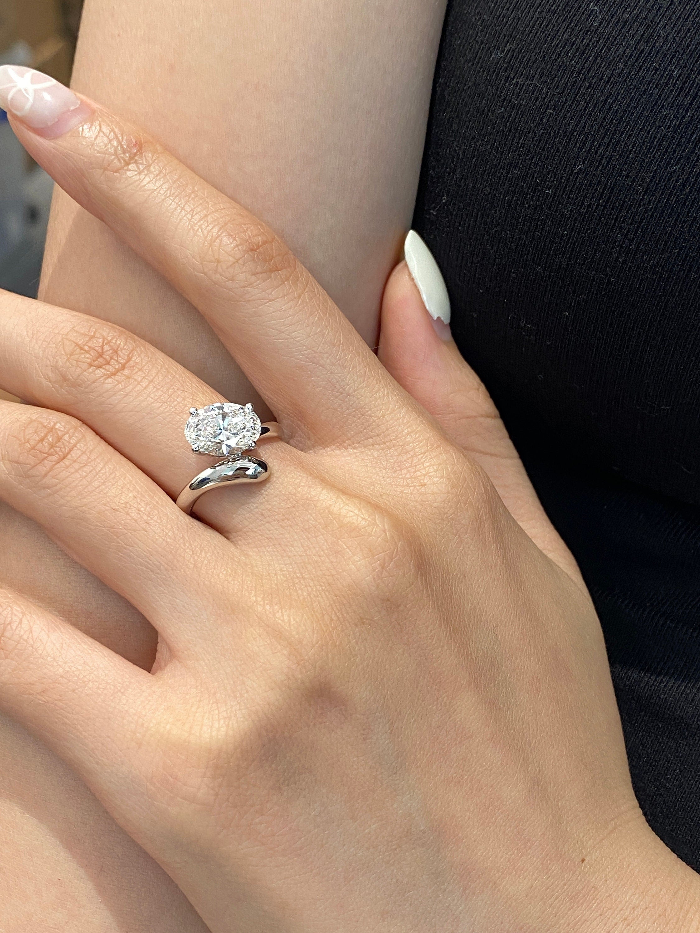 14k gold oval hidden halo lab grown diamond engagement ring, three-quarter view showing fine craftsmanship