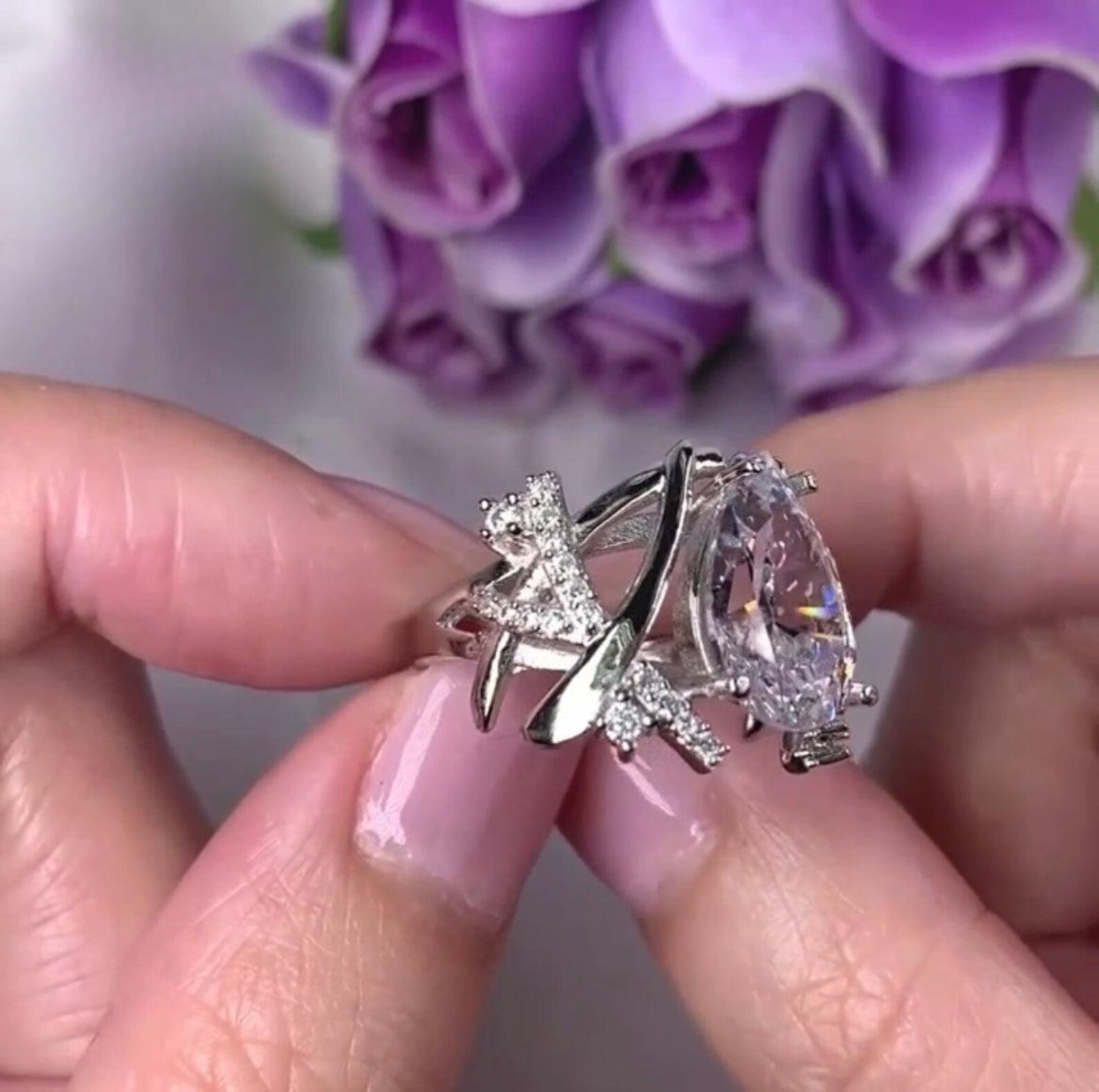 14k gold pear lab grown diamond engagement ring, detailed close-up showing fine craftsmanship