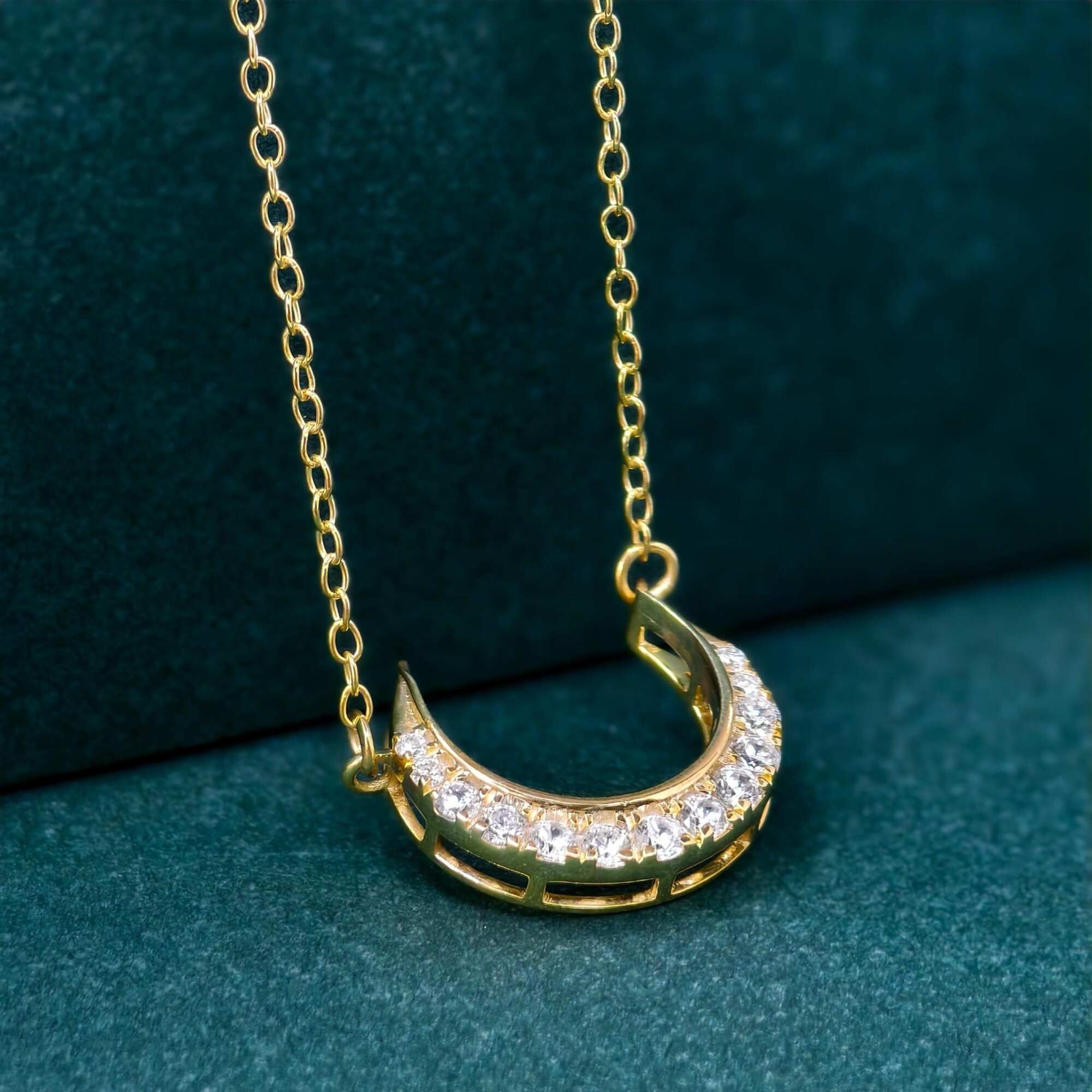 14k gold crescent moon lab grown diamond charm necklace, top angle view showing fine craftsmanship