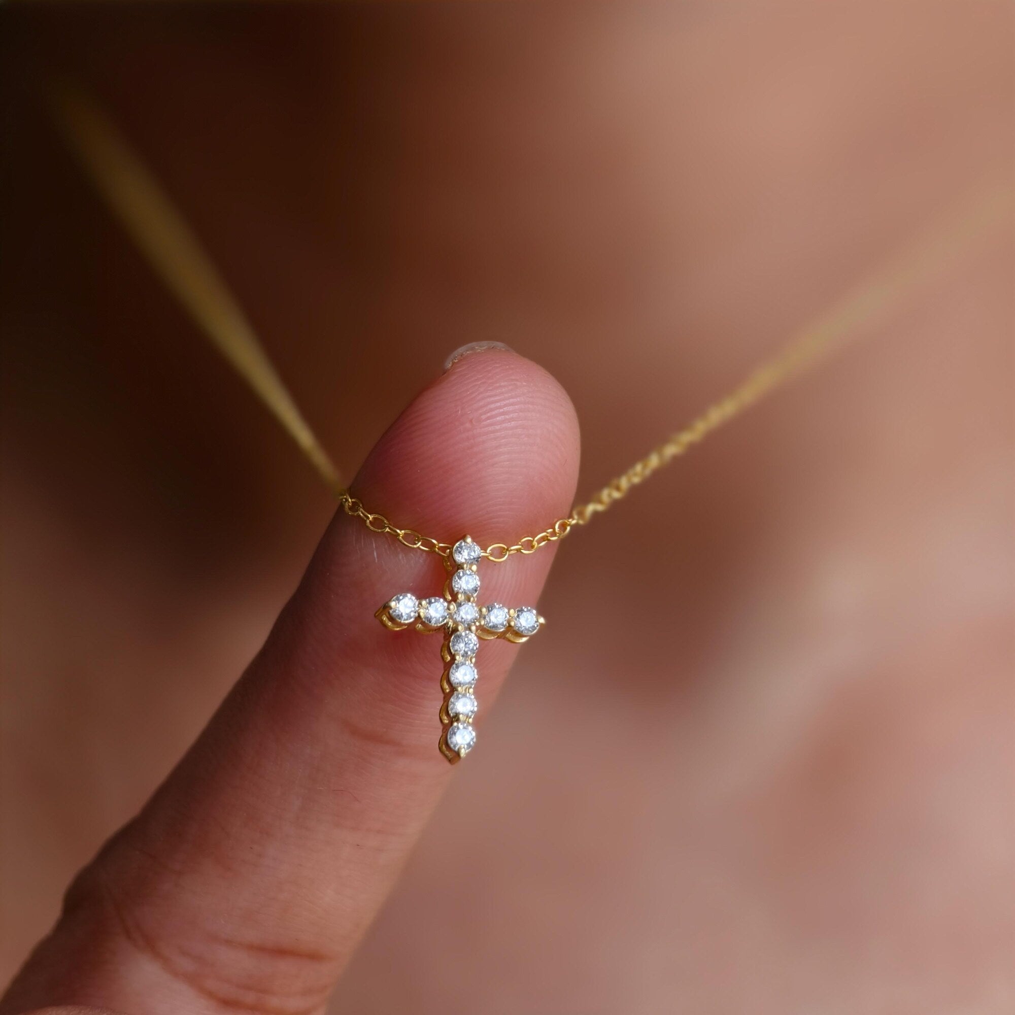 14k gold cross lab grown diamond pendant necklace, detailed close-up showing fine craftsmanship and a polished finish