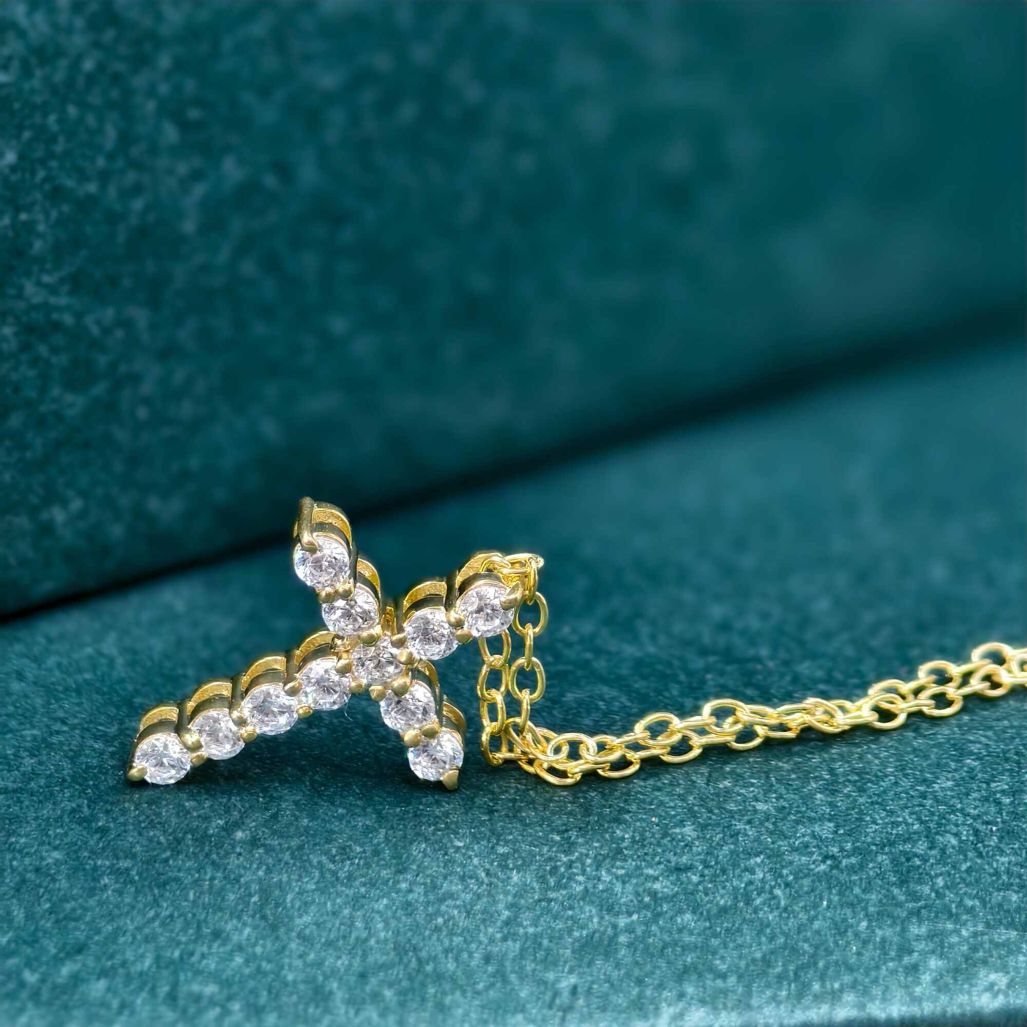 14k gold cross lab grown diamond pendant necklace, top angle view showing fine craftsmanship and a polished finish