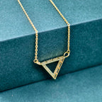 14k gold triangle lab grown diamond pendant necklace, styled on model showing fine craftsmanship