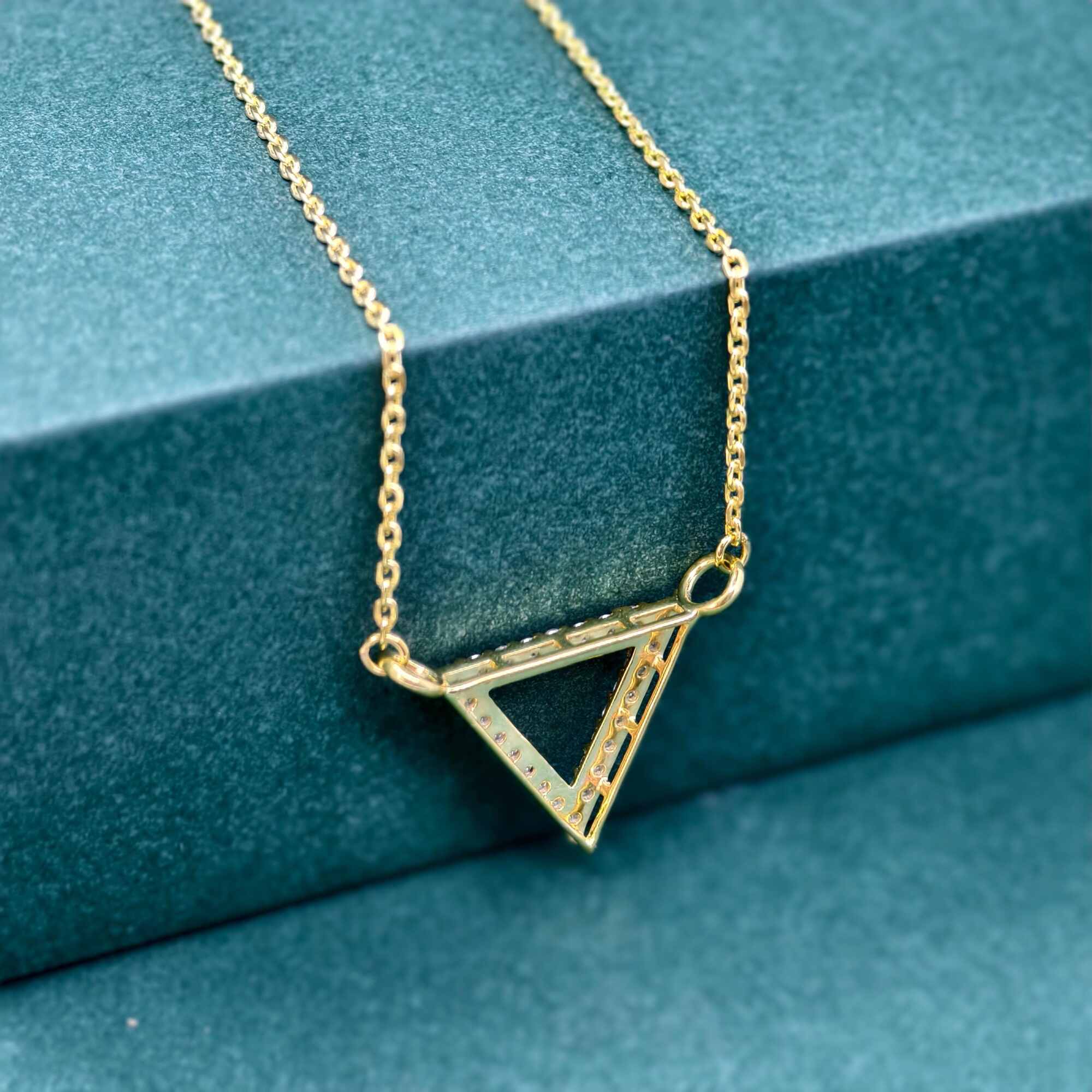14k gold triangle lab grown diamond pendant necklace, styled on model showing fine craftsmanship