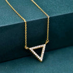 14k gold triangle lab grown diamond pendant necklace, top angle view showing fine craftsmanship