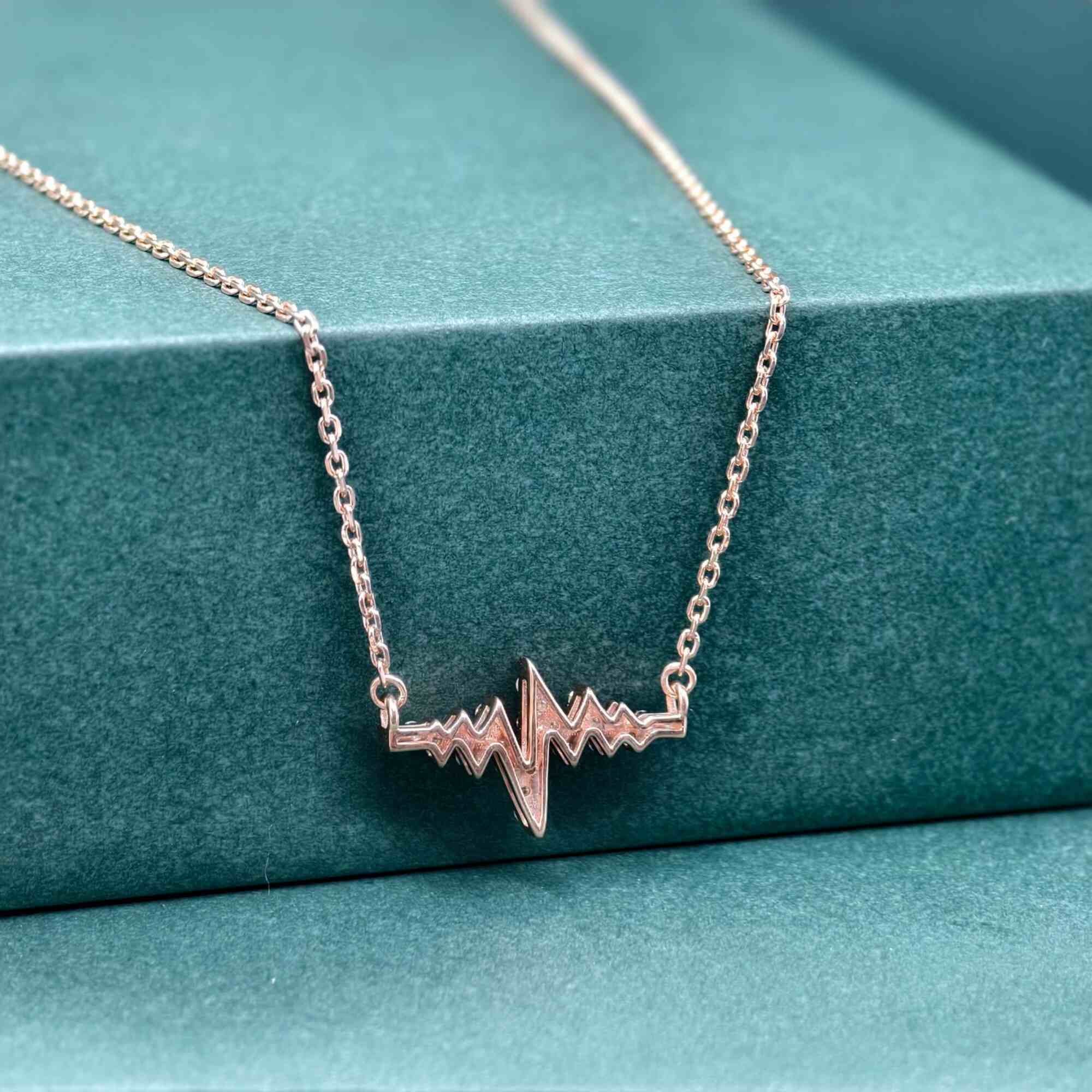 14k gold heartbeat lab grown diamond pendant necklace, side profile view showing fine craftsmanship