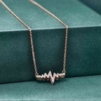 14k gold heartbeat lab grown diamond pendant necklace, top angle view showing fine craftsmanship