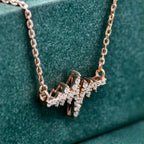 14k gold heartbeat lab grown diamond pendant necklace, sparkle detail shot showing fine craftsmanship