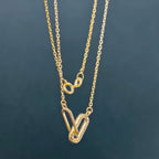 14k gold paperclip lab grown diamond charm necklace, styled on model showing fine craftsmanship