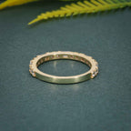 14k gold round dainty lab grown diamond wedding band, lifestyle shot showing fine craftsmanship