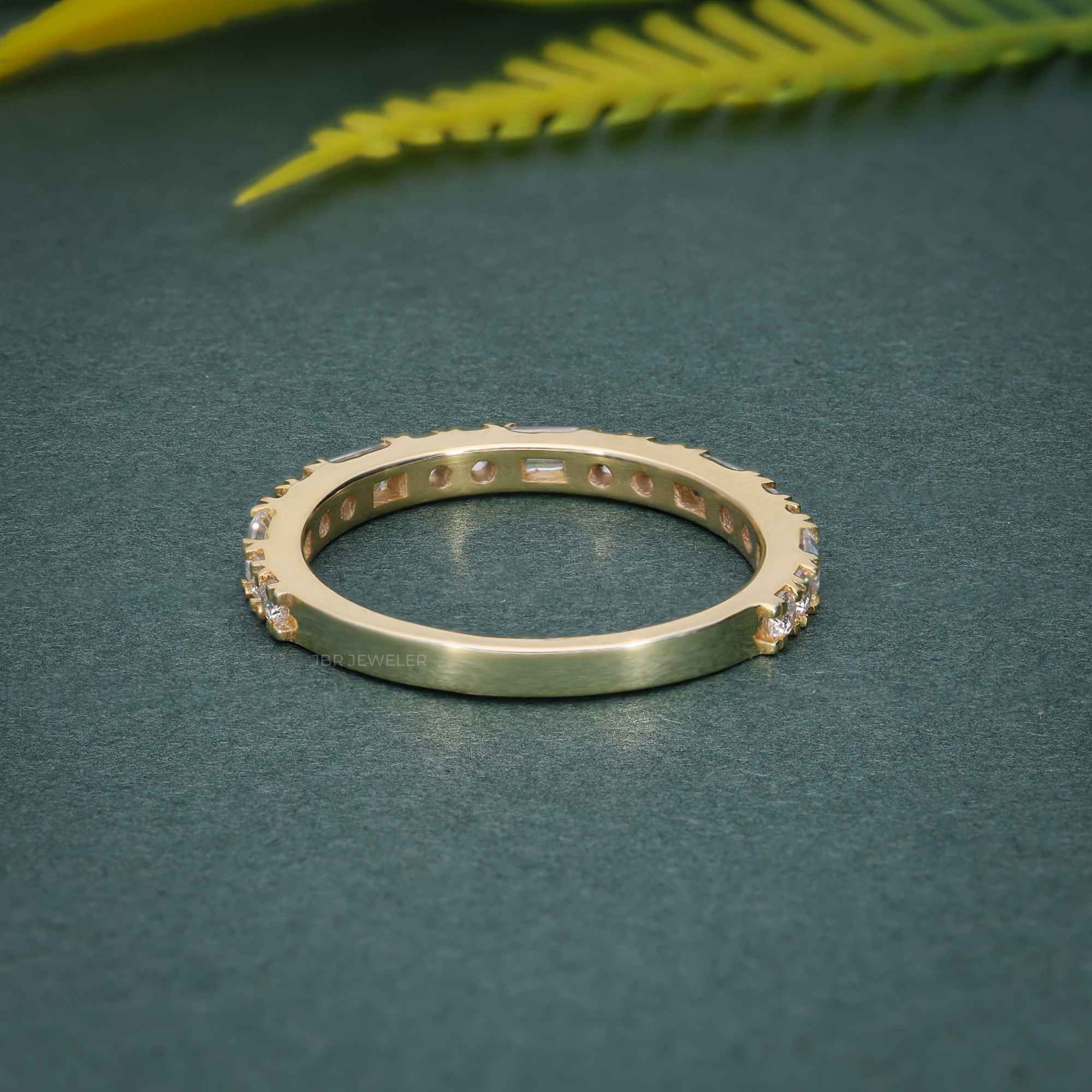 14k gold round dainty lab grown diamond wedding band, lifestyle shot showing fine craftsmanship