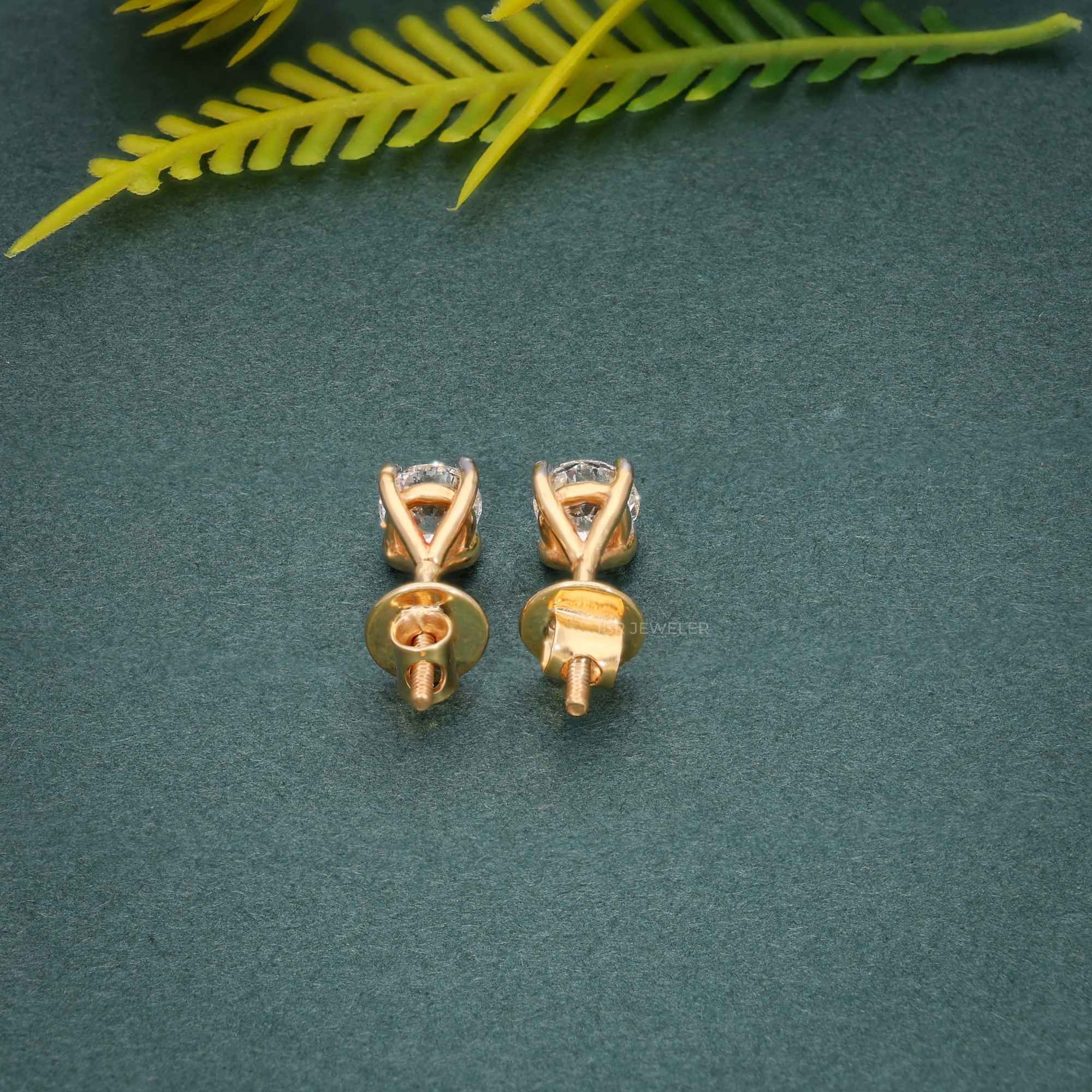 14k gold round prong-set lab grown diamond stud earrings, macro detail view showing fine craftsmanship